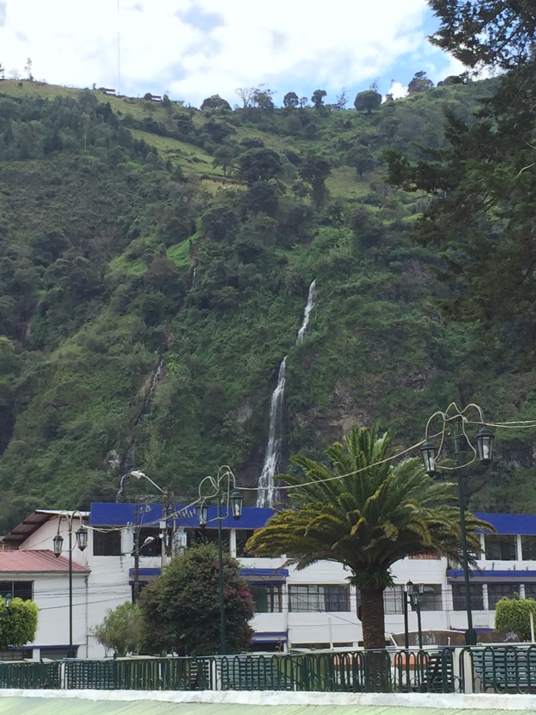 A waterfall seen from the town of Banos