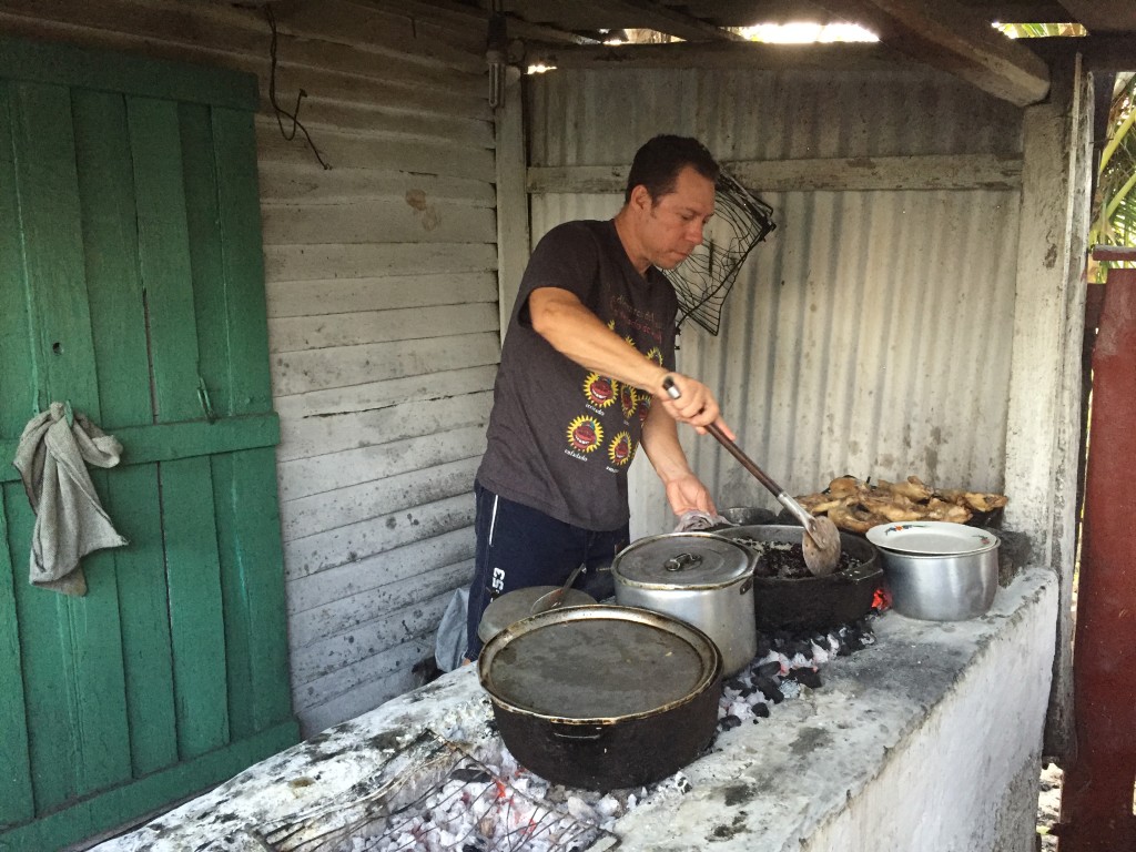 Tony helping our cook on their charcoal "stove"